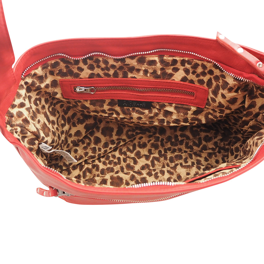 Cadelle Blondie red leather hobo bag with stud detailing and slouchy shape inside view