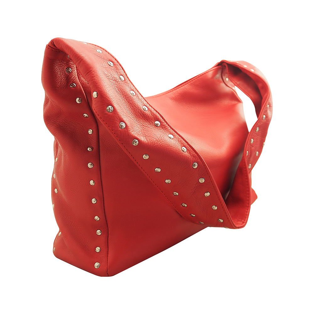 Cadelle Blondie red leather hobo bag with stud detailing and slouchy shape side view