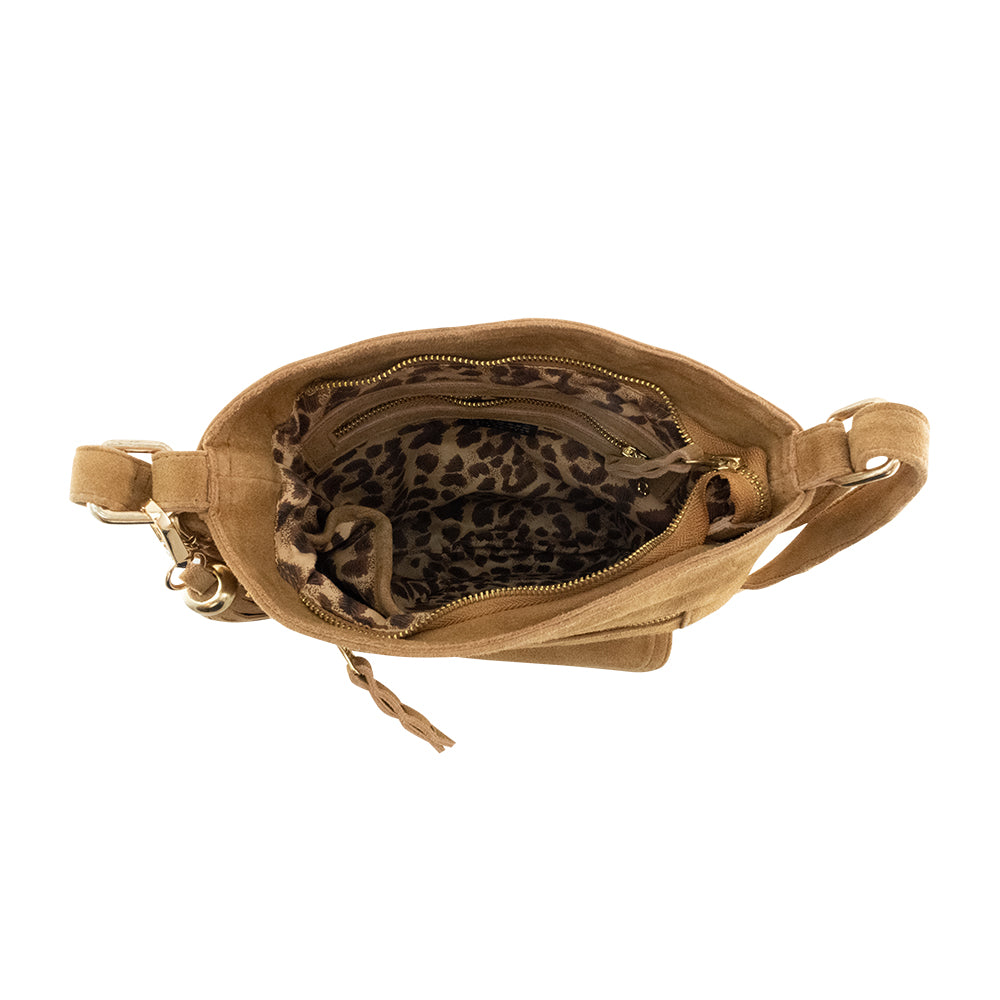 Cadelle Shelley tan suede crossbody bag with woven flap and gold key lock inside view