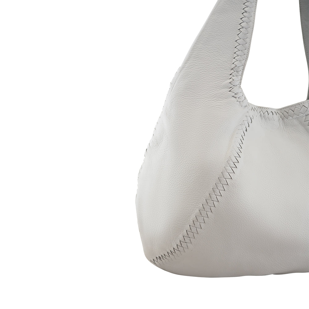 Cadelle Patrizia white leather hobo bag with braided and blanket stitch detail close up view