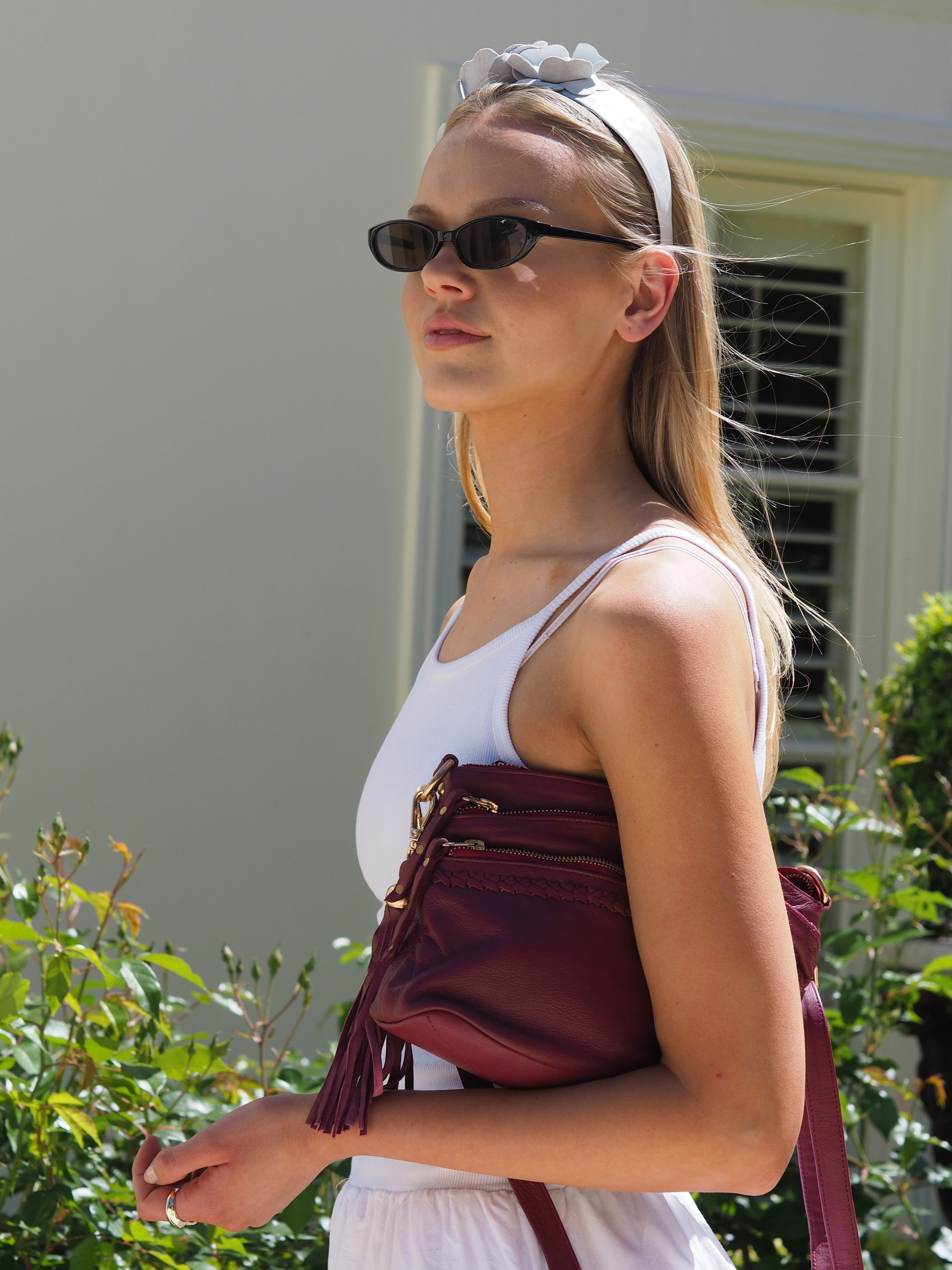 Cadelle Bridgette berry leather crossbody bag with multiple zip pockets