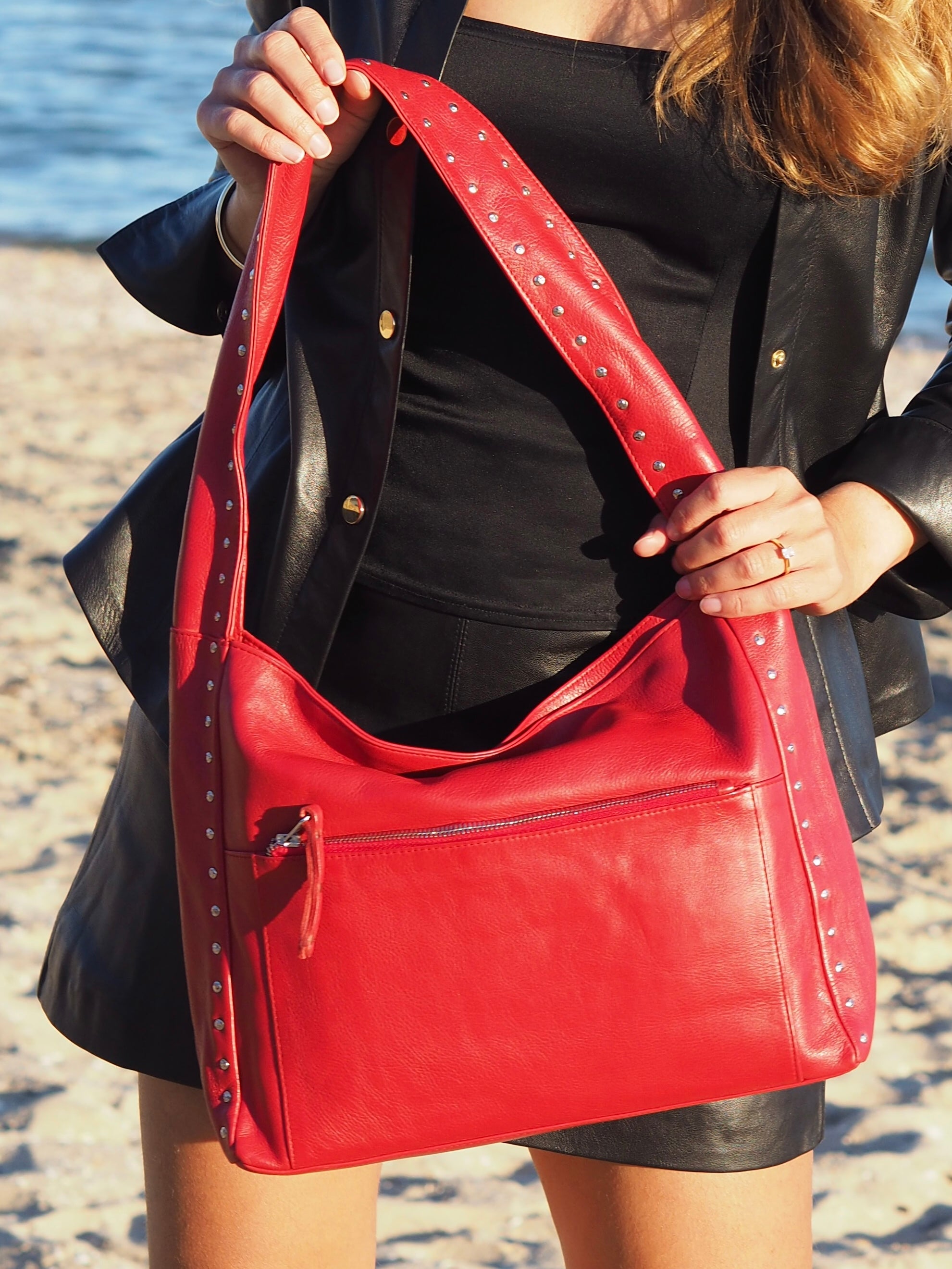 Cadelle Blondie red leather hobo bag with stud detailing and slouchy shape