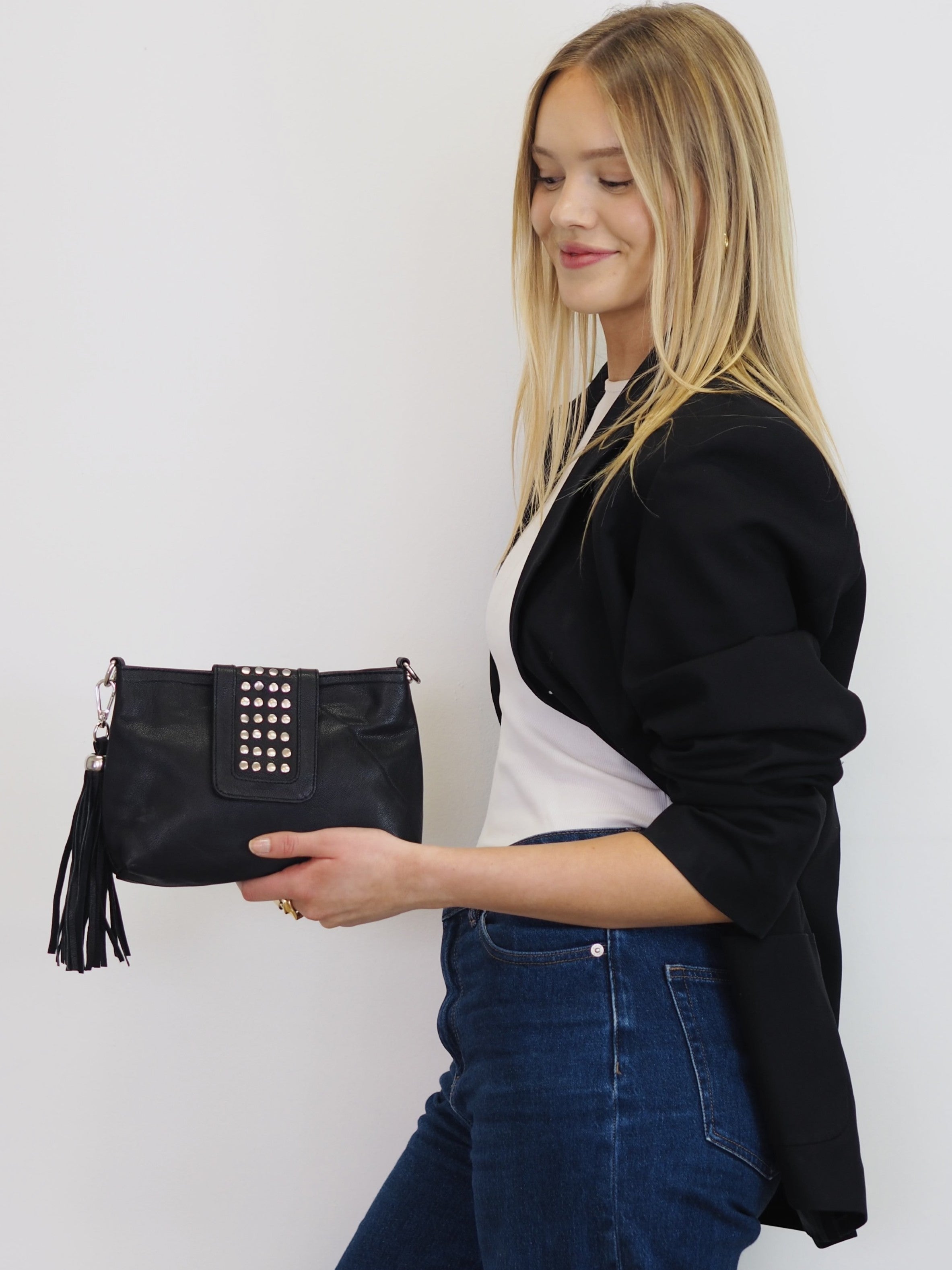 Gigi black leather crossbody with silver stud detail and detachable tassel