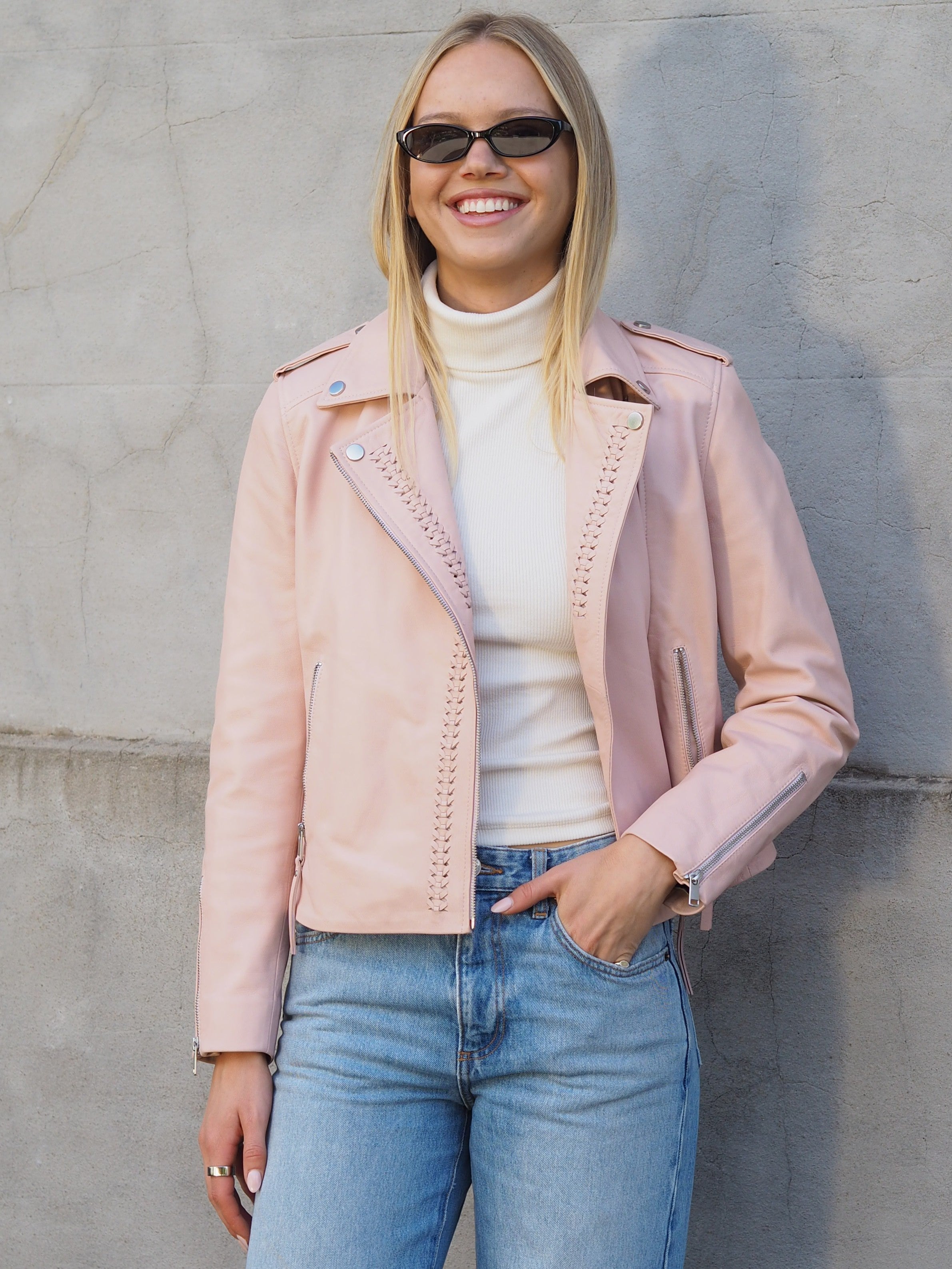 Imogen blush pink leather biker jacket with silver studs and zippers and braid detailing