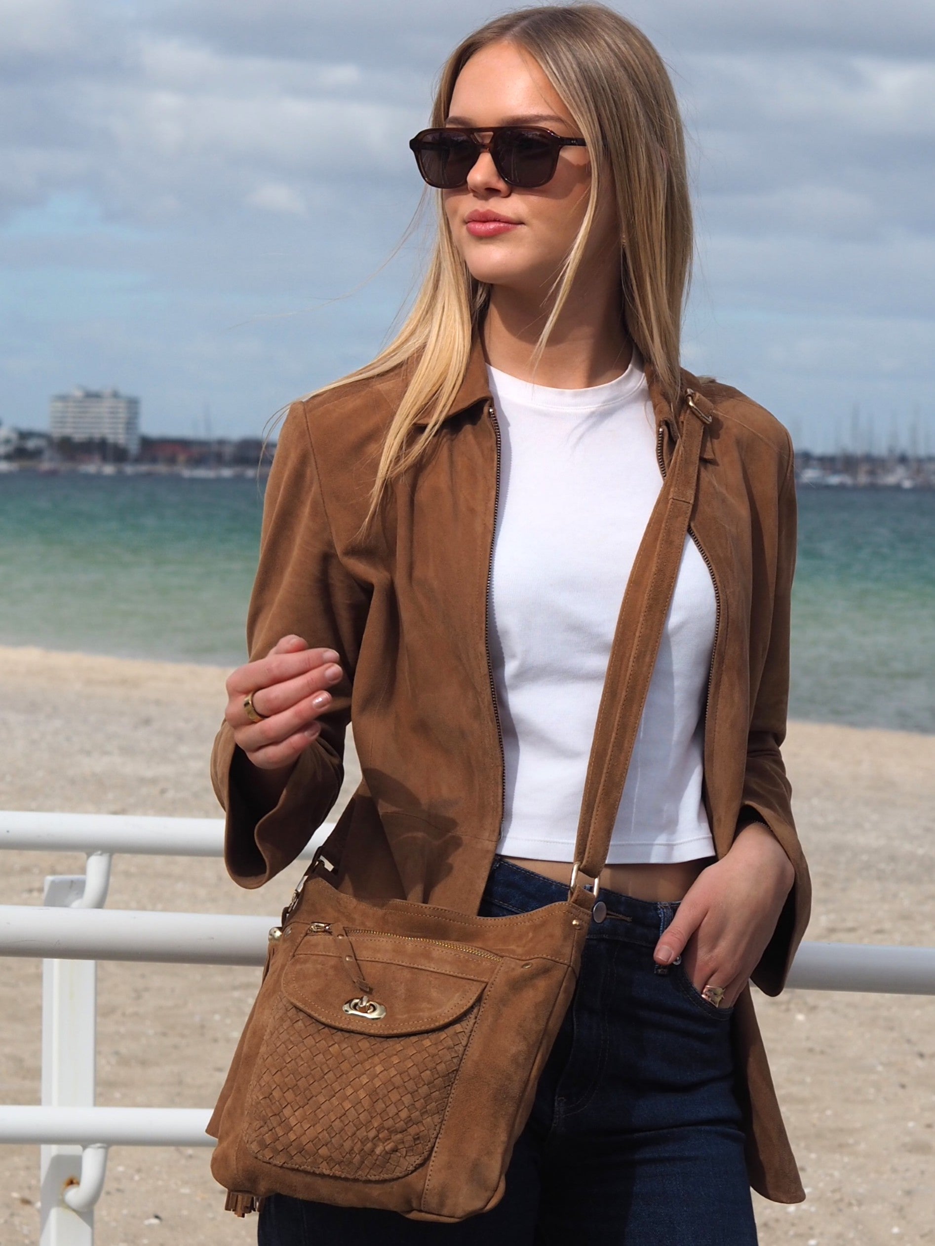 Cadelle Shelley tan suede crossbody bag with woven flap and gold key lock