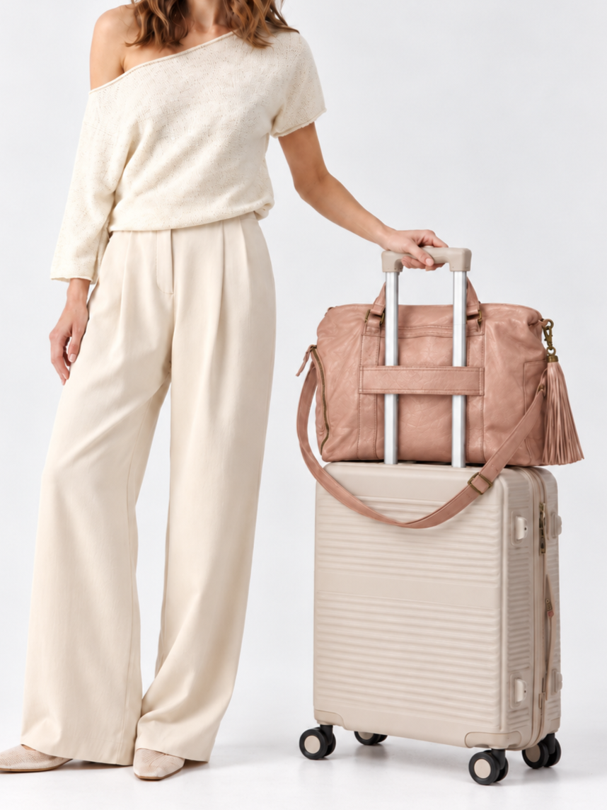 Cadelle Victoria metallic pink overnighter shown how the luggage sleeve works