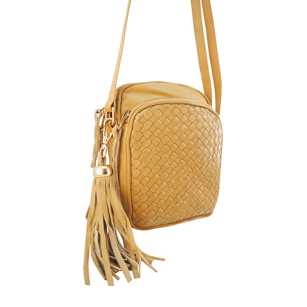 Cadelle Pippa camel leather crossbody bag with woven front zip pocket side view