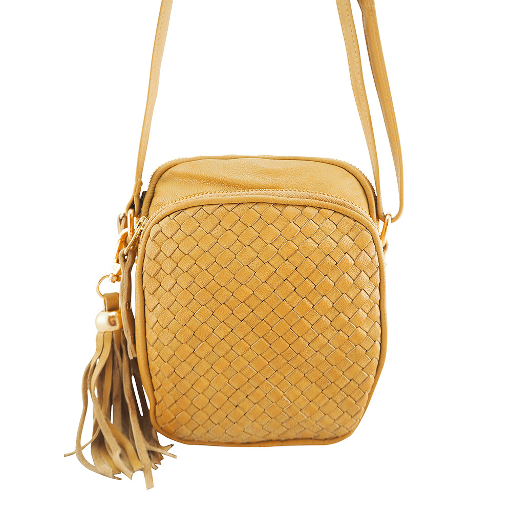 Cadelle Pippa camel leather crossbody bag with woven front zip pocket front view
