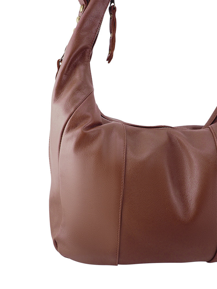 Cadelle Suki chocolate leather hobo bag with slouchy silhouette and tassel detail close up view