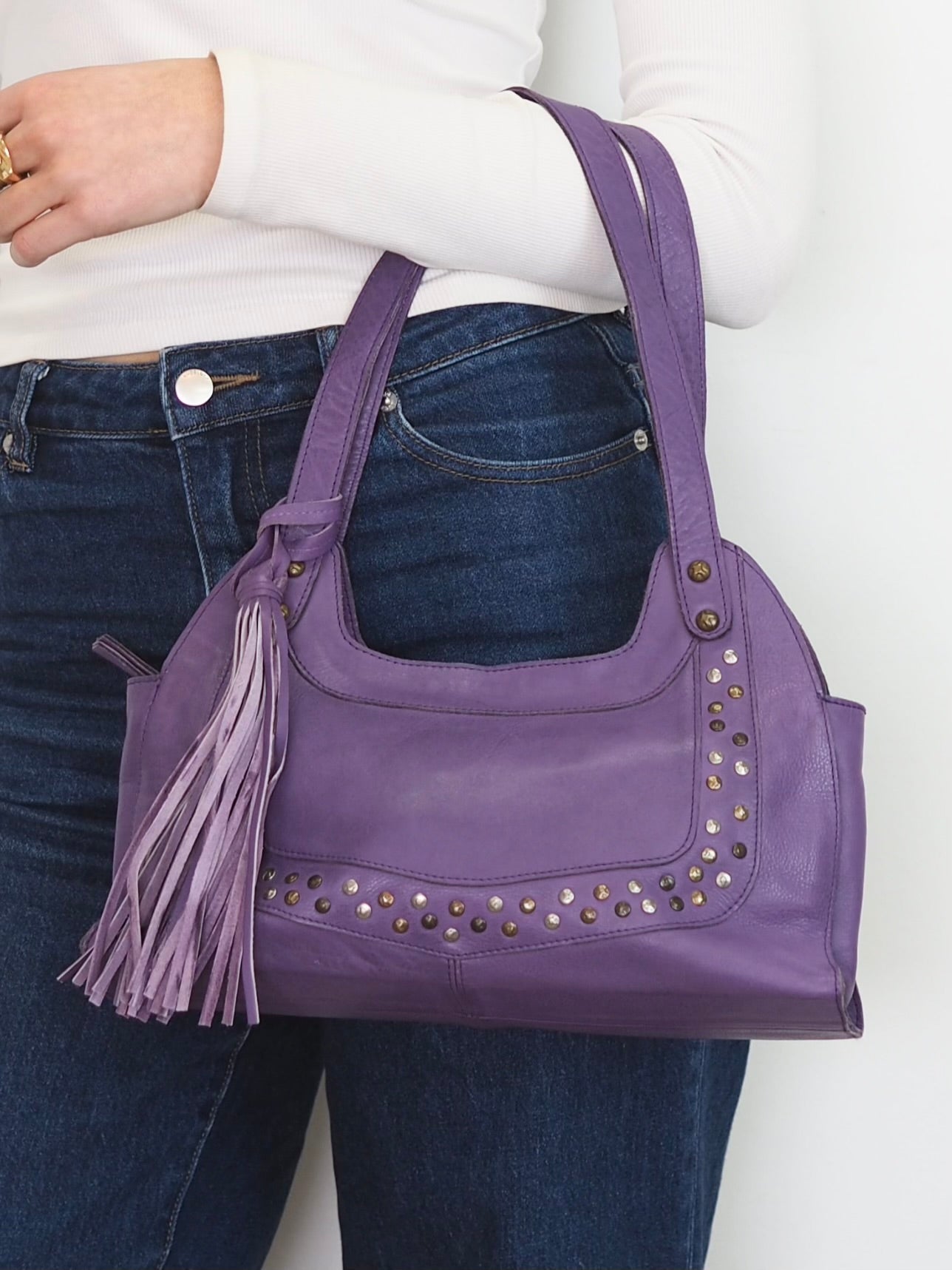 Violet soft leather handbag with stud details