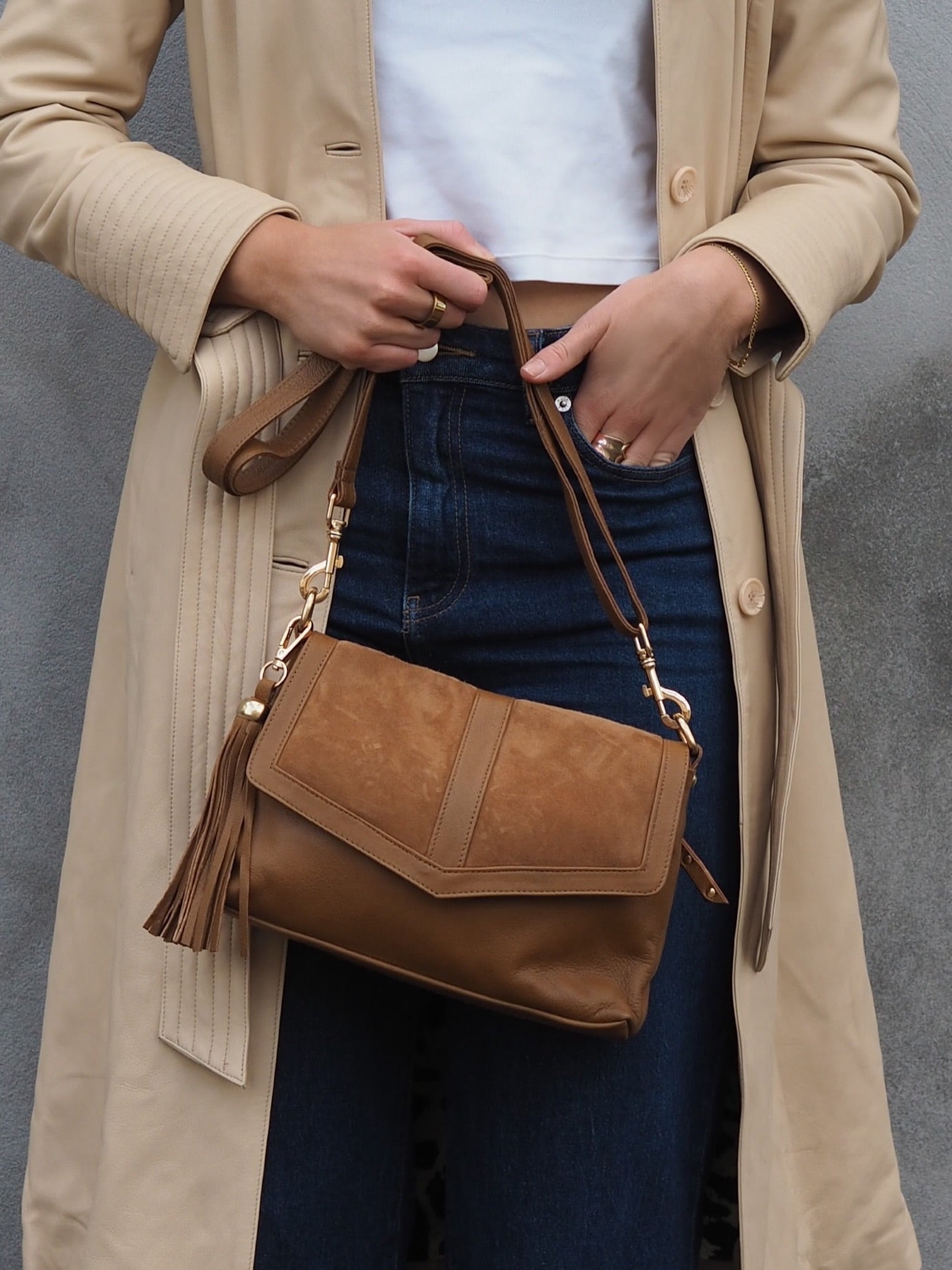 Tan leather and suede crossbody bag with tassel