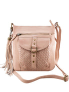  Millie Misty Rose leather crossbody bag with a woven front pocket, brass-tone hardware, a front zipper, and a tassel charm, shown on a plain white background.