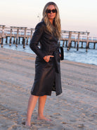 Side view of Claire black leather trench coat