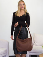 Elli chocolate leather convertible backpack to bag on the crook of the arm
