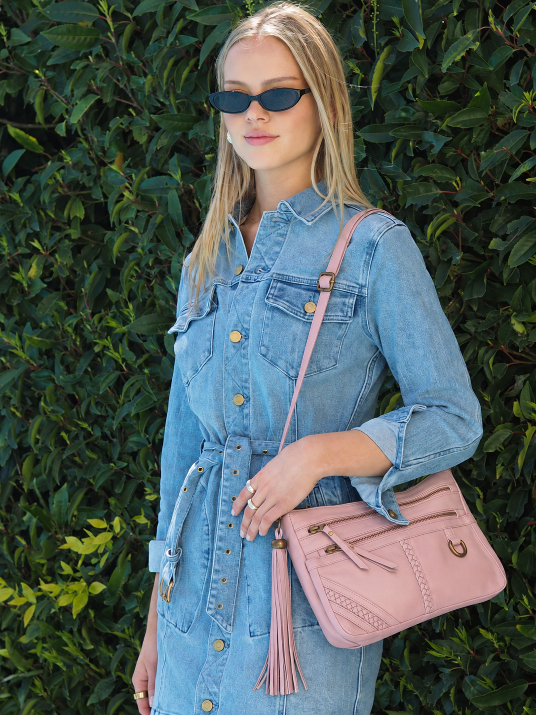 Peggy misty rose pink leather shoulder bag with zip pockets, detachable tassel and adjustable shoulder strap