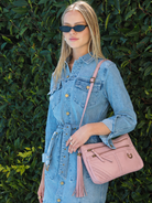 Peggy misty rose pink leather shoulder bag with zip pockets, detachable tassel and adjustable shoulder strap