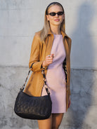 Cadelle Susie black leather handbag with slouchy shape and zip pockets