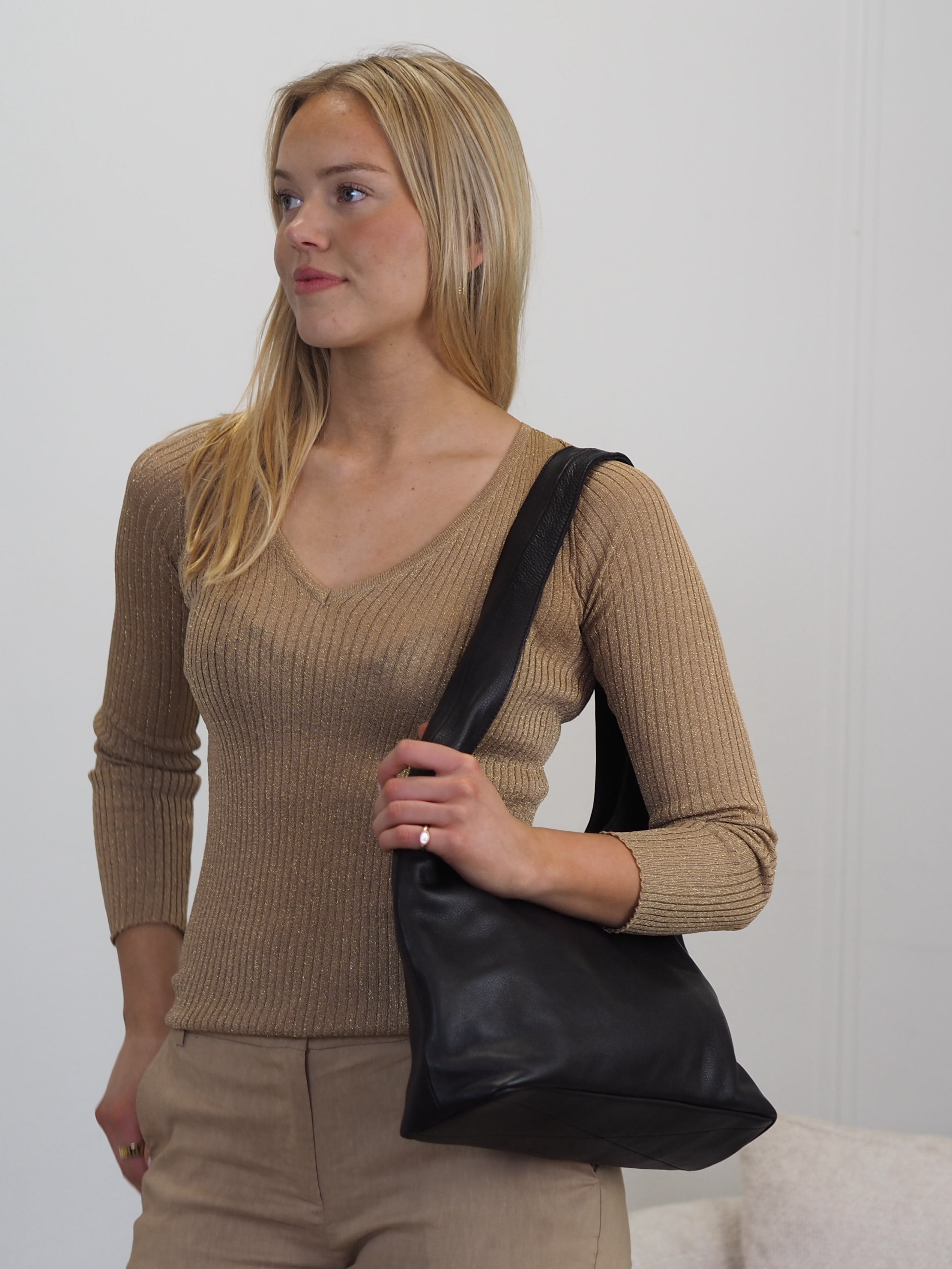Scarlett black leather slouchy hobo worn on the shoulder