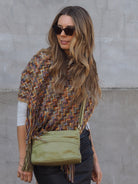 Olive green leather bag with plait detail on the front