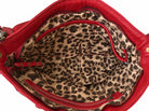 Cadelle Maria red leather crossbody showing the inside of the bag with leopard print lining 