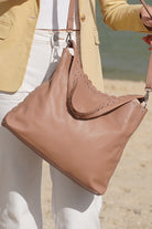 Mocha chocolate handbag with scallop edges close up
