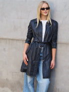 Navy leather trench coat with belt tie