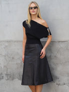 Cadelle Felicity black leather midi skirt with seam detail and A-line shape front view