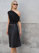 Cadelle Felicity black leather midi skirt with seam detail and A-line shape side view