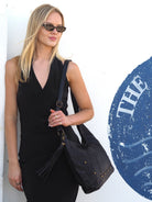 Cadelle Carrie black leather hobo bag with stud detail and slouchy silhouette
