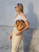 Cadelle Piper camel leather shoulder bag with structured design side view