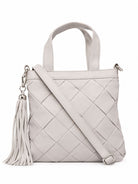 Cadelle Carter light gray woven leather handbag with top handles, a shoulder strap, and a matching tassel 