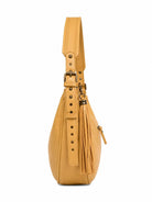 Cadelle Helena butter leather  shoulder bag with a tassel charm and antique brass hardware- side view