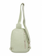 Cadelle Karissa mint green leather sling bag back view with a matching shoulder strap, a vertical zippered pocket and silver-tone hardware