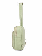 Cadelle Karissa mint green  leather sling bag with a matching adjustable shoulder strap, shown from a side profile view 
