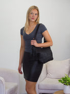Jada black leather woven front shoulder bag with a detachable tassel