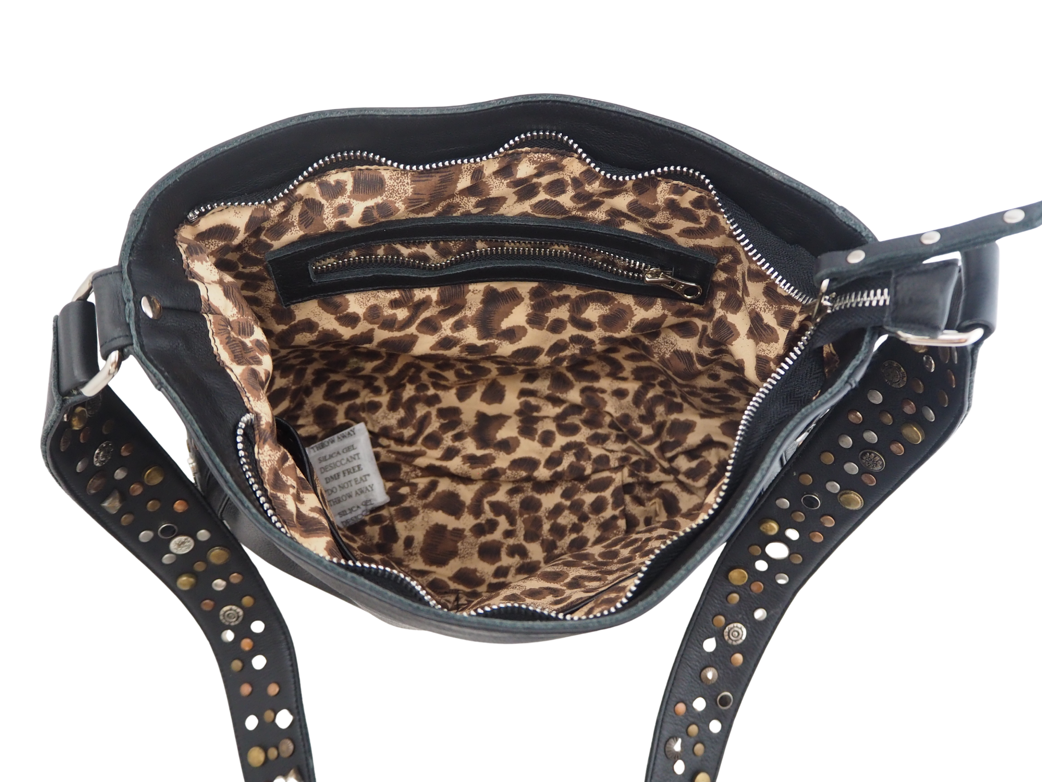 Leopard print bag interior of the leather  with studded black handle 